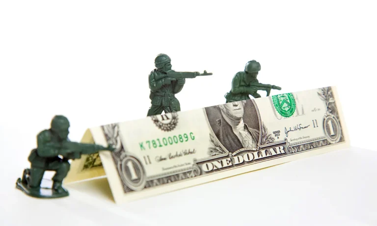 Bomb or build? How party ideologies affect the balance of foreign aid and defence spending